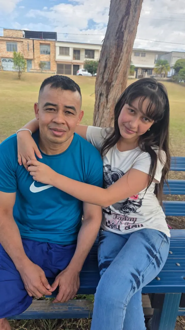 Nando sharing a family moment on a park bench